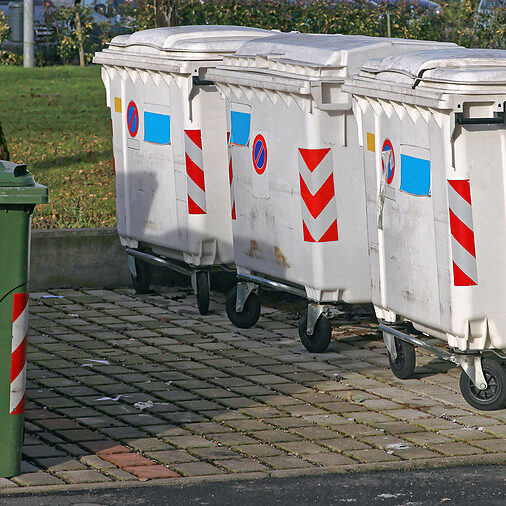 garbage dumpsters near the road